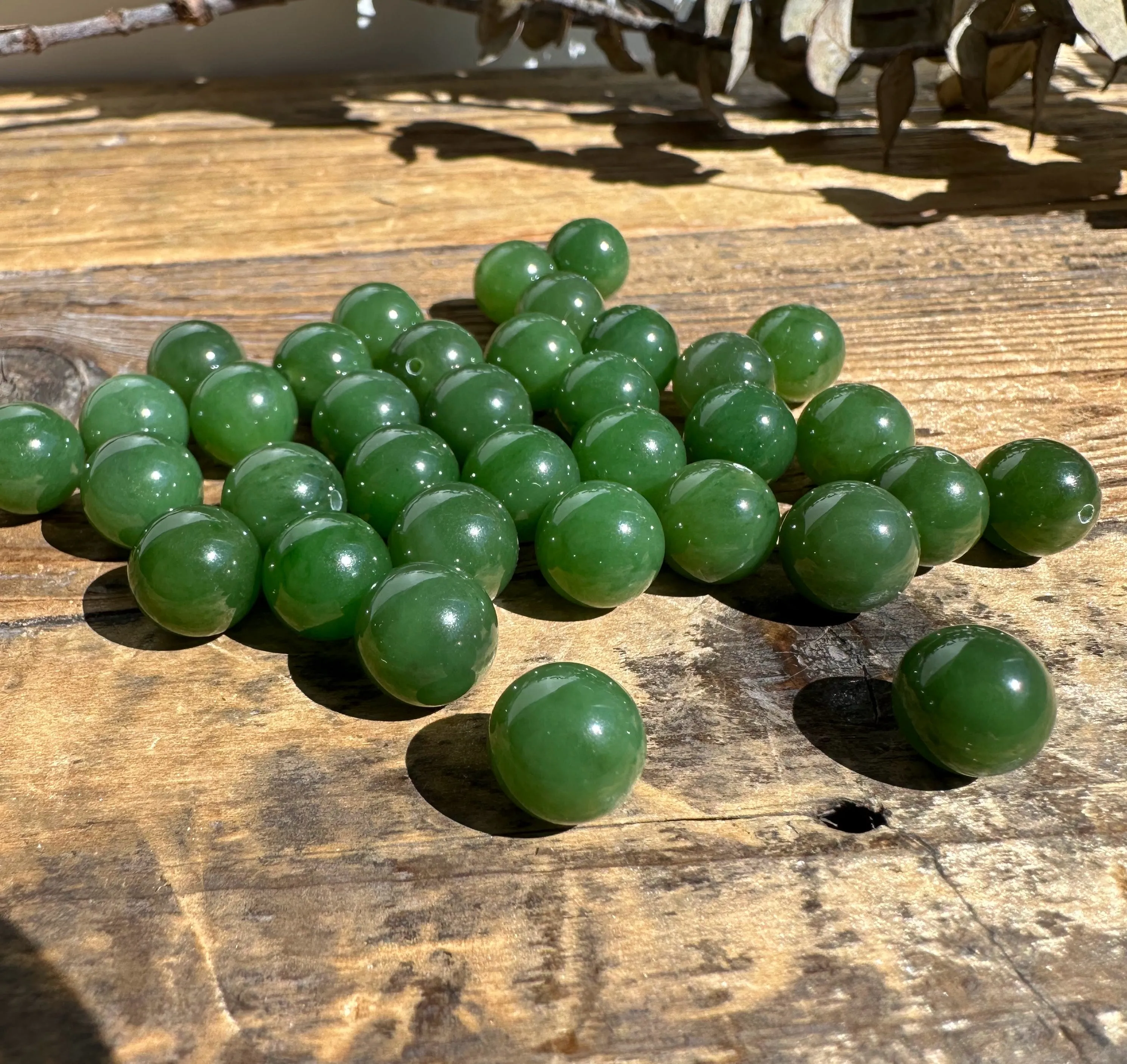 A  Half Drilled 10mm Canadian Jade Beads